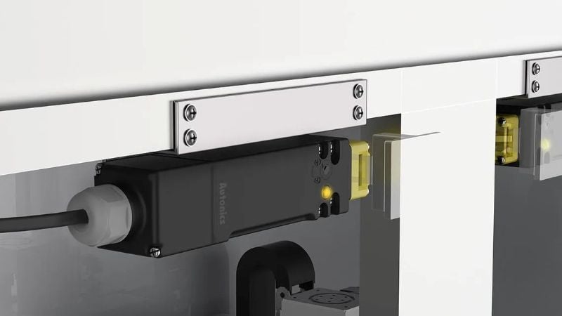 Autonics’ SFDL series functioning as a safety locking mechanism within a packaging machine, securing the door during operational periods