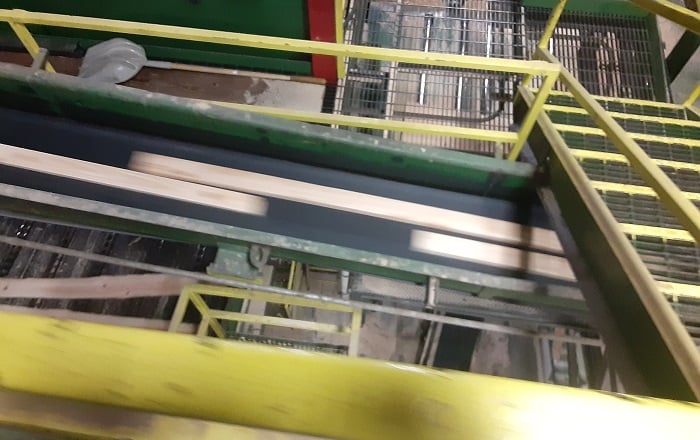 Figure 1. Belt-driven conveyor using constant motion to transport wood products. Image used courtesy of Control.