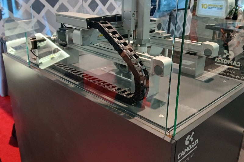 A machine demonstration with integrated actuators, drives, gripping systems, and communication devices.