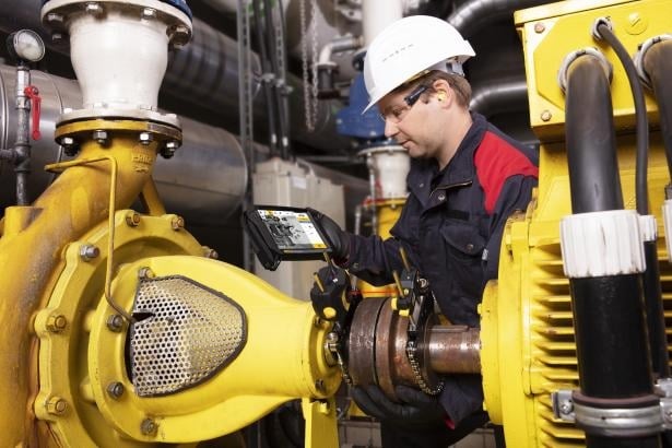  Figure 3. Technician using a laser alignment tool on rotating equipment.