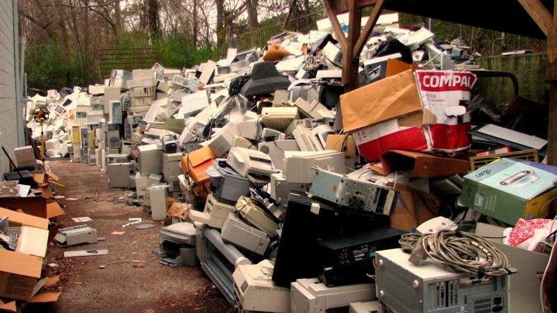 A large pile of e-waste awaits burial at a landfill or a fiery fate at an incinerator.