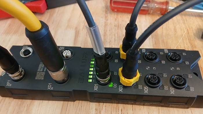 Figure 3. This IO-Link project is using ports X03 and X04 (the M12 cables with the yellow collars).