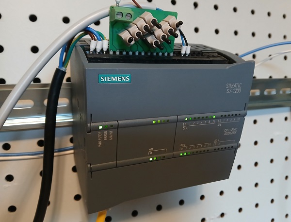 Figure 2. The PLC with the simplautor board and two additional pushbuttons.
