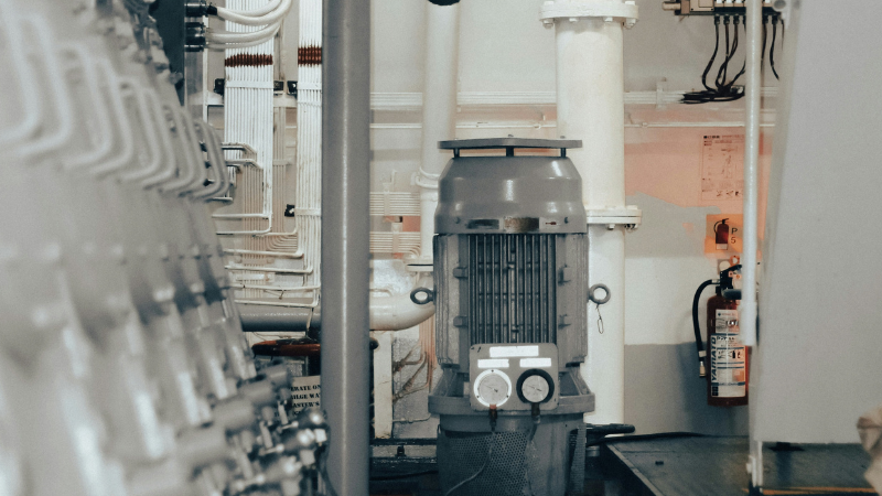 An industrial pumping application with a large AC motor driving the pump