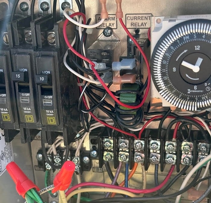  Figure 2. Inside a traditional septic control box, the connections are exposed and non-coded.
