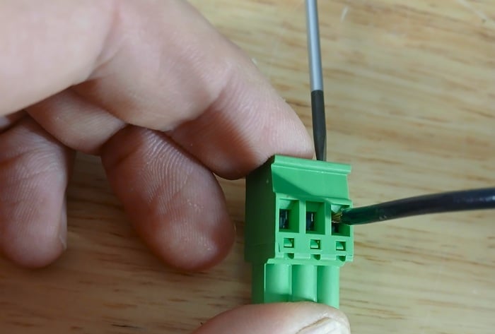 Figure 2. Clamping down a pressure wire terminal.
