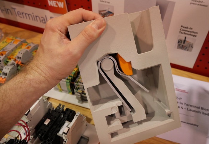 Interactive 3D model of a push-in terminal illustrating how they work. Push the solid or ferruled wire in, then press the button (with a small screwdriver on a life-size version) to release the wire.