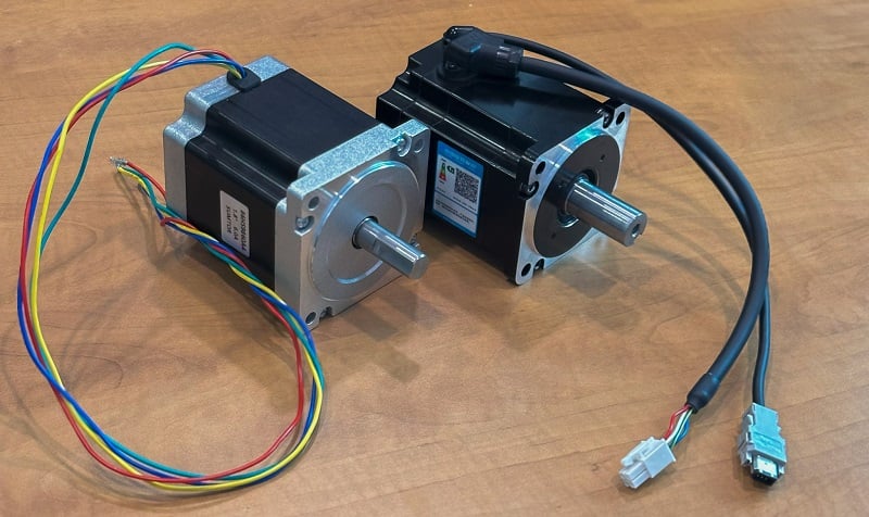 Figure 2. A simple stepper motor (left) vs a servo motor, evidenced by the encoder feedback cable (right).